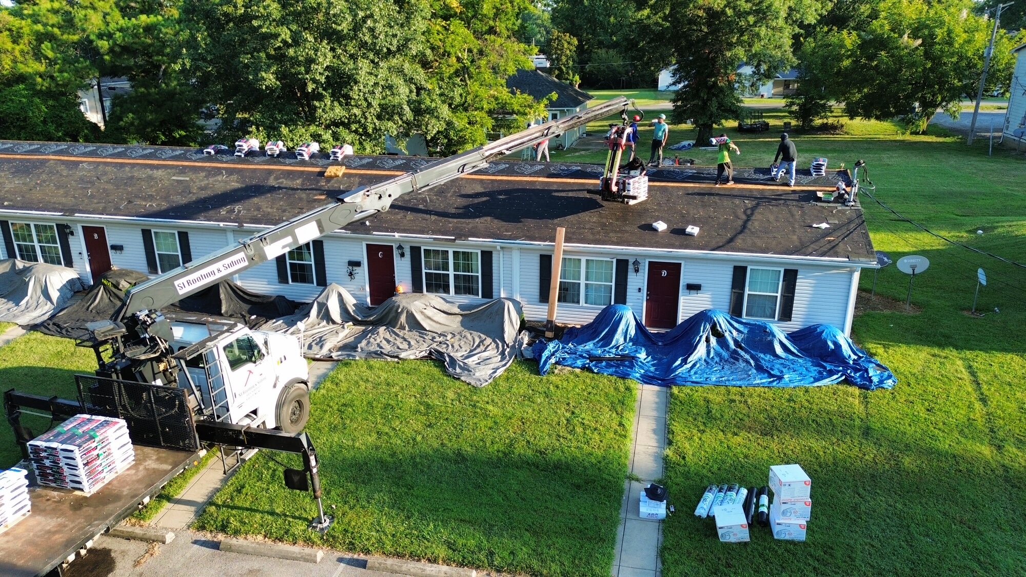Top-down view of an active roof replacement project